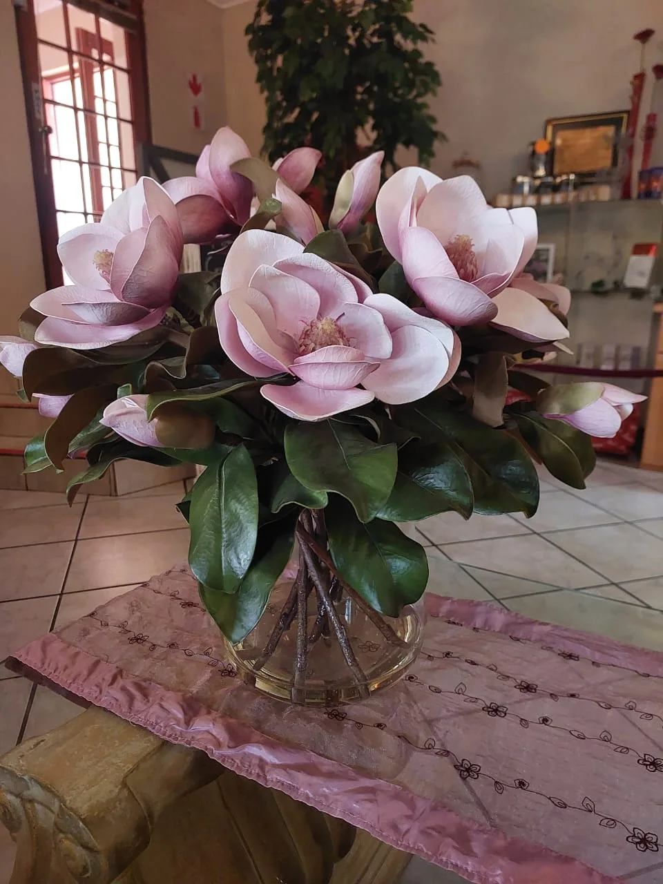 Magnolia arrangement inside the Annique salon